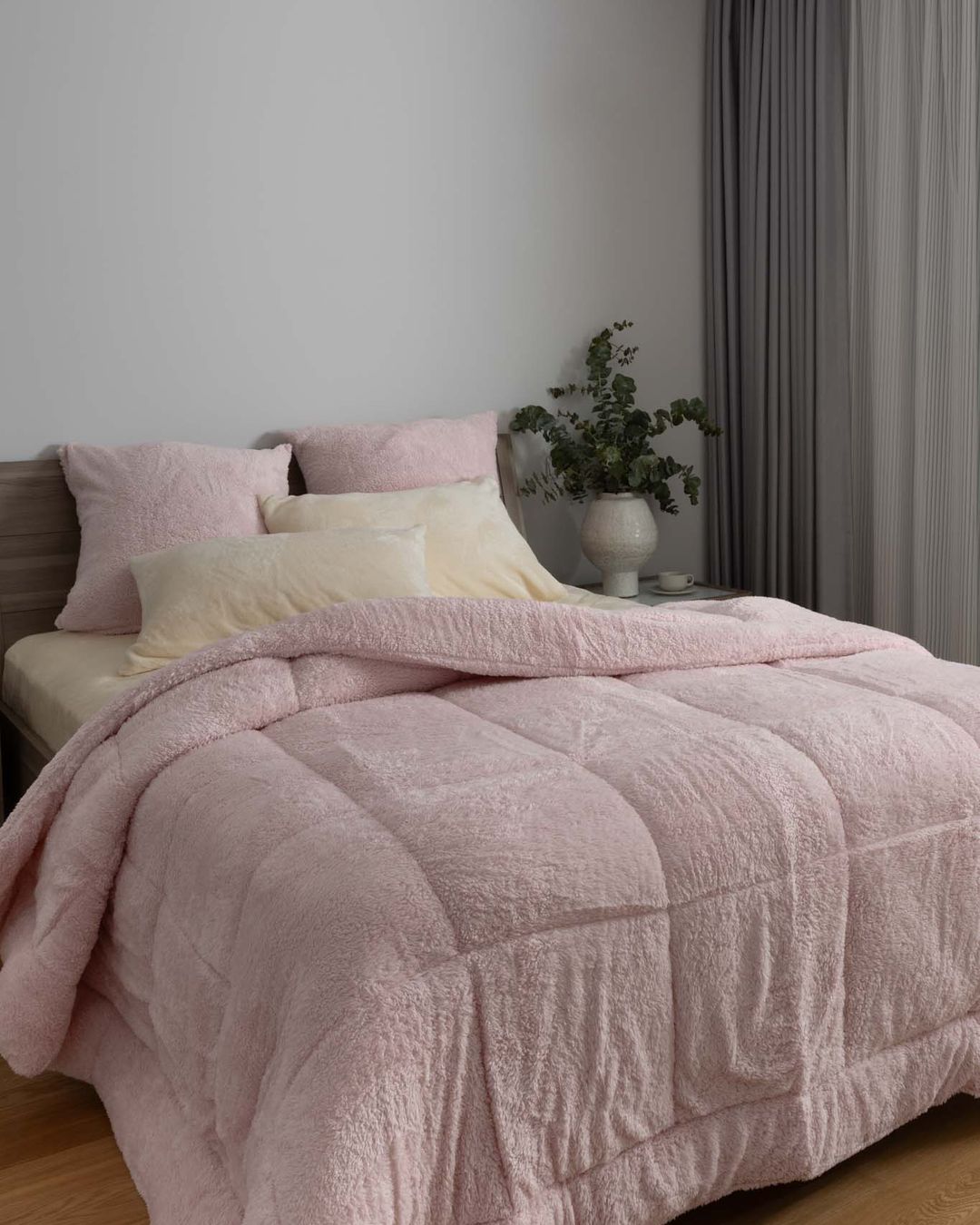 Morgan and Reid Chalk Pink Snuggle Fleece Comforter Set styled on a neatly made bed in a bright bedroom