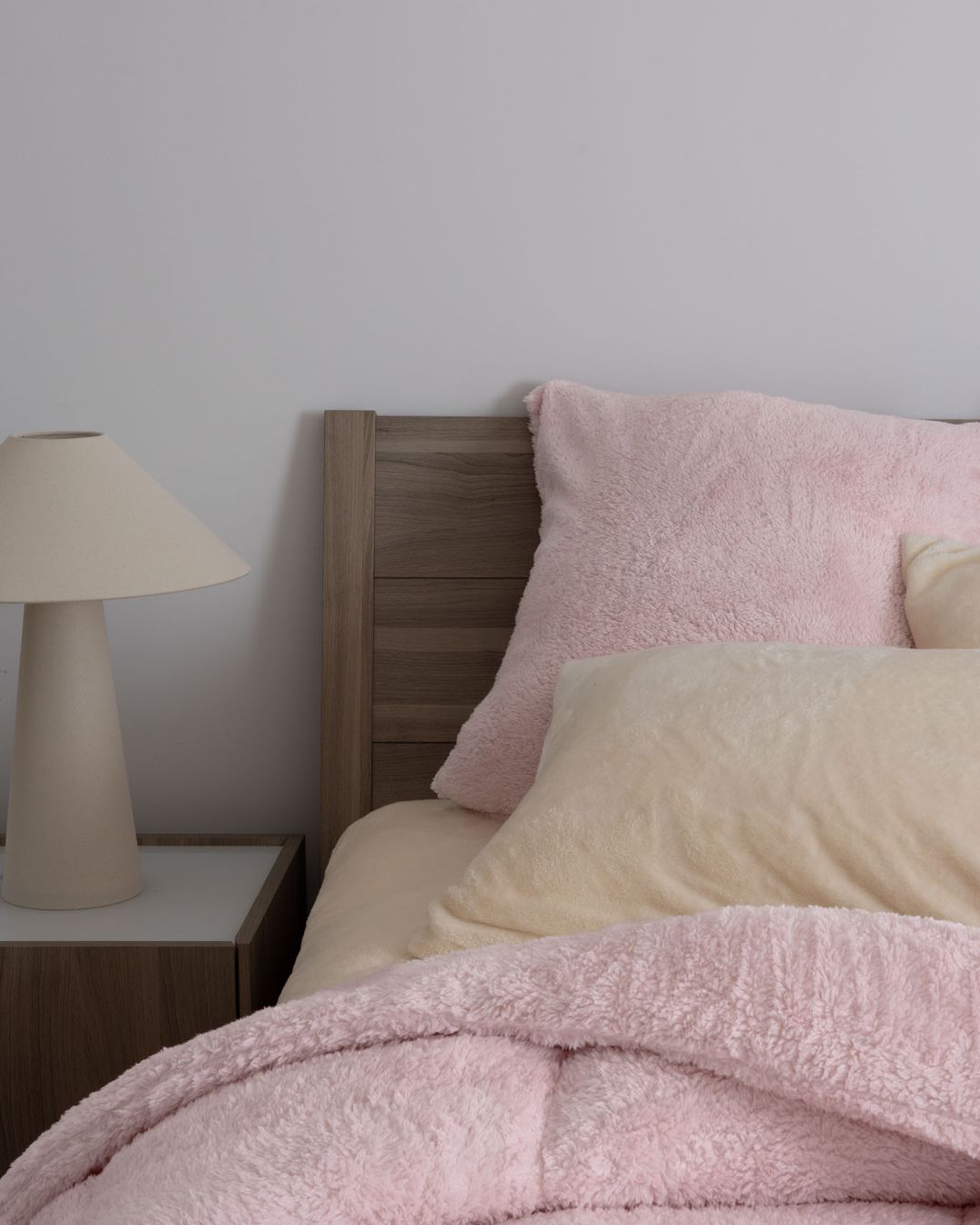 Overhead view of the Morgan and Reid Chalk Pink Snuggle Fleece Comforter Set on a made bed