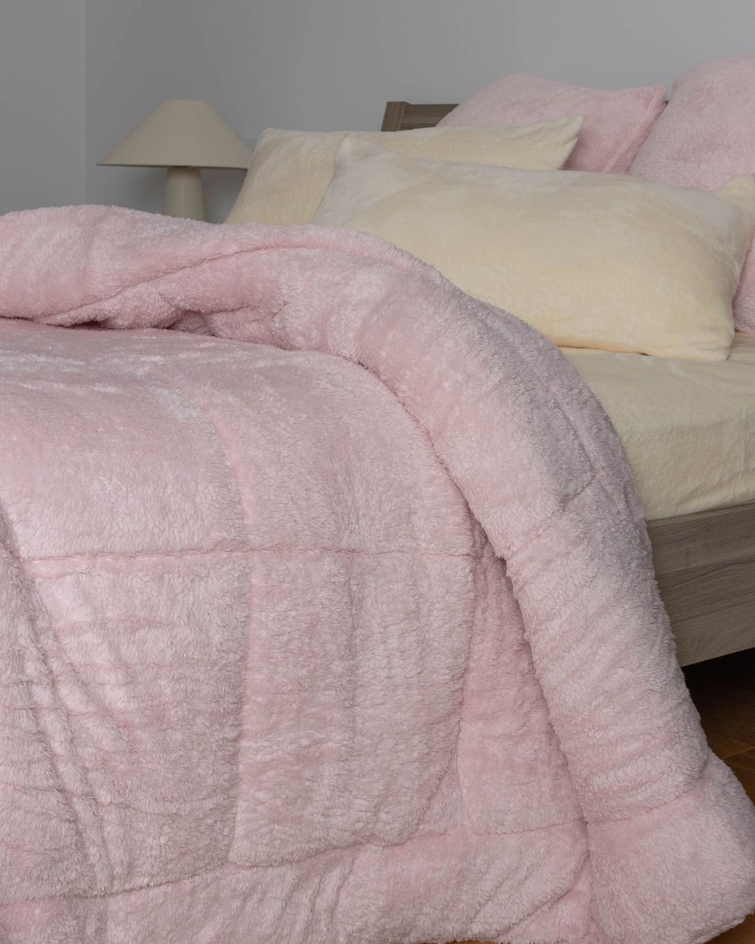Detail shot of the Morgan and Reid Chalk Pink Snuggle Fleece European Pillowcase Pair on a pillow