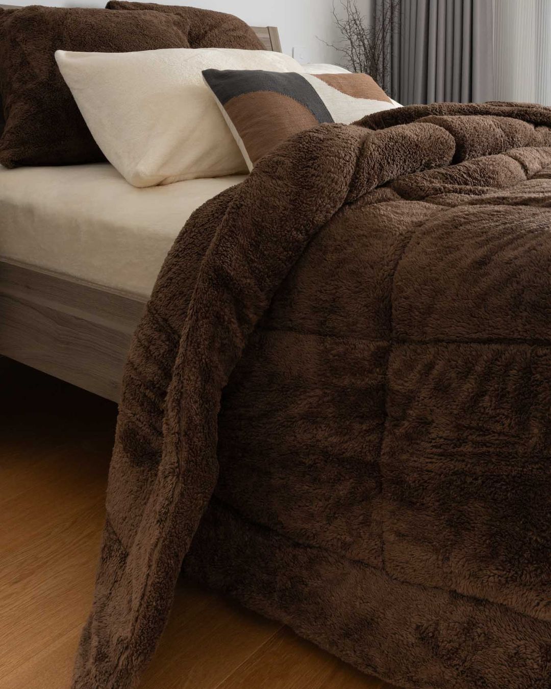 Detail shot of the Morgan and Reid Cocoa Snuggle Fleece European Pillowcase Pair on a pillow