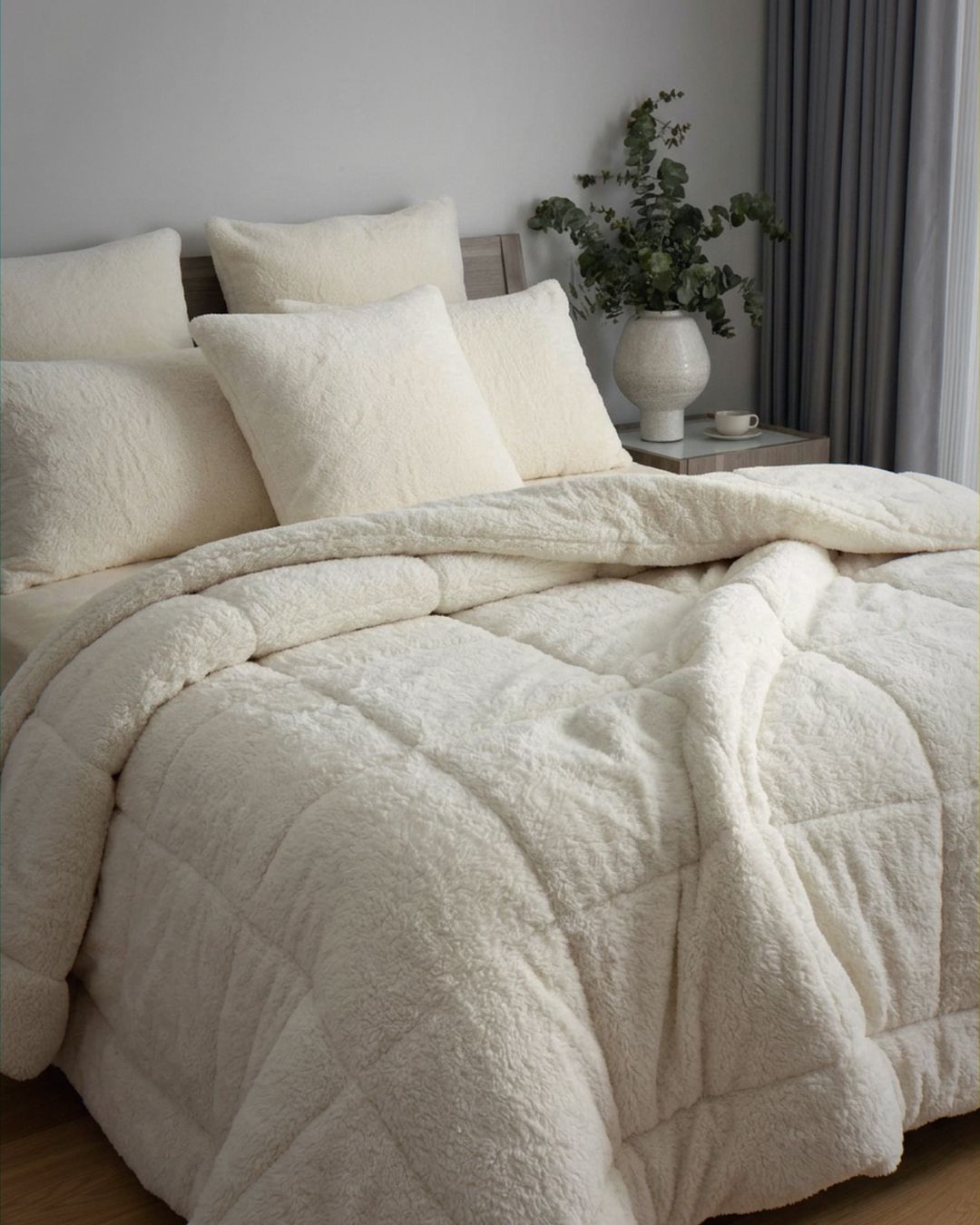 Morgan and Reid Ivory Snuggle Fleece European Pillowcase Pair on bed with coordinating bedding