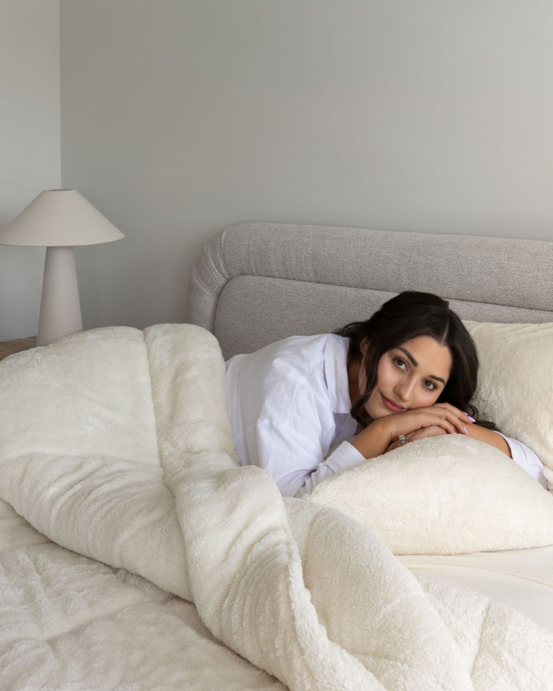 Morgan and Reid All Seasons Snuggle Fleece Ivory Comforter Set on a bed with matching pillowcases