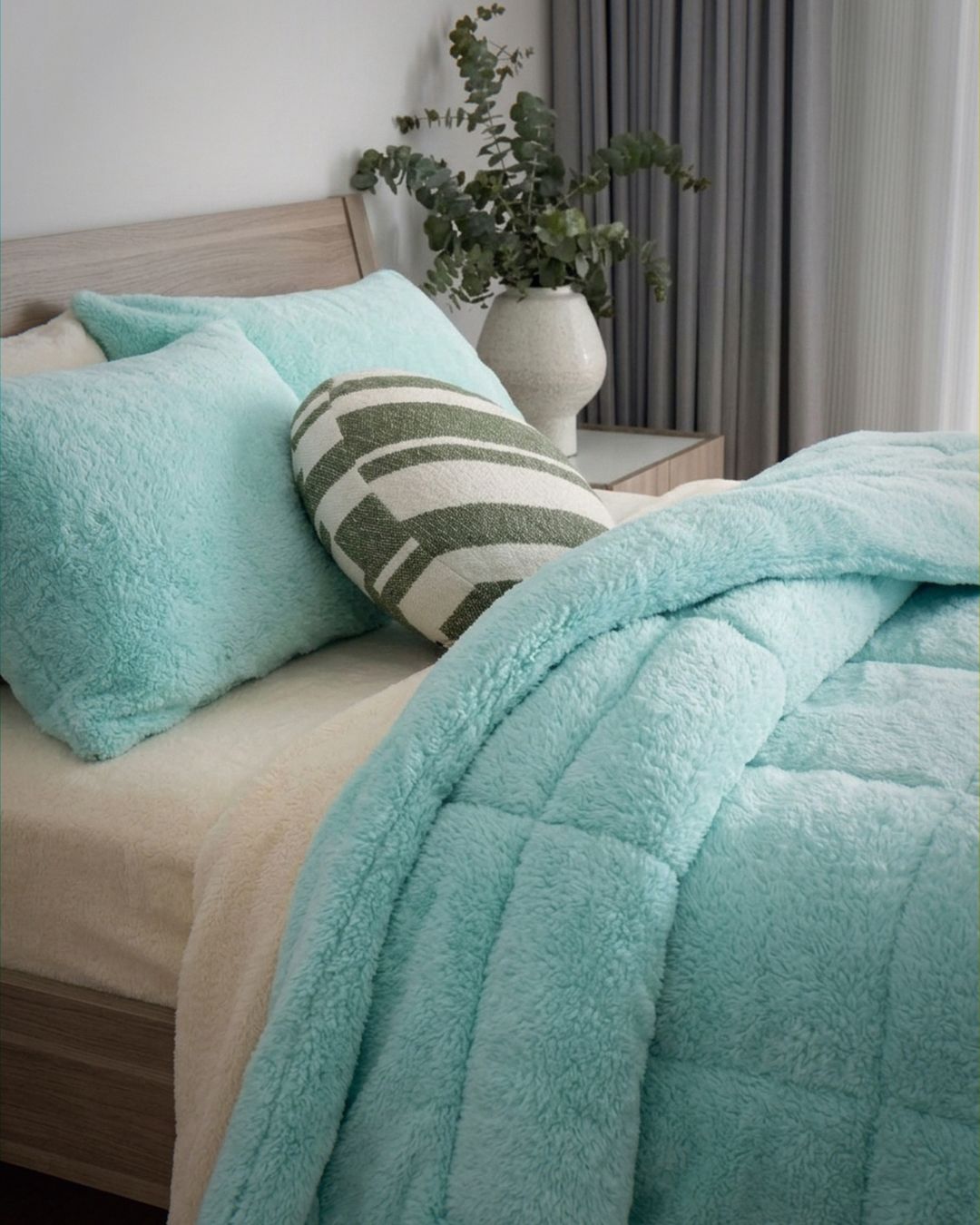 Morgan and Reid All Seasons Snuggle Fleece Mint Comforter Set on a bed with matching pillowcases