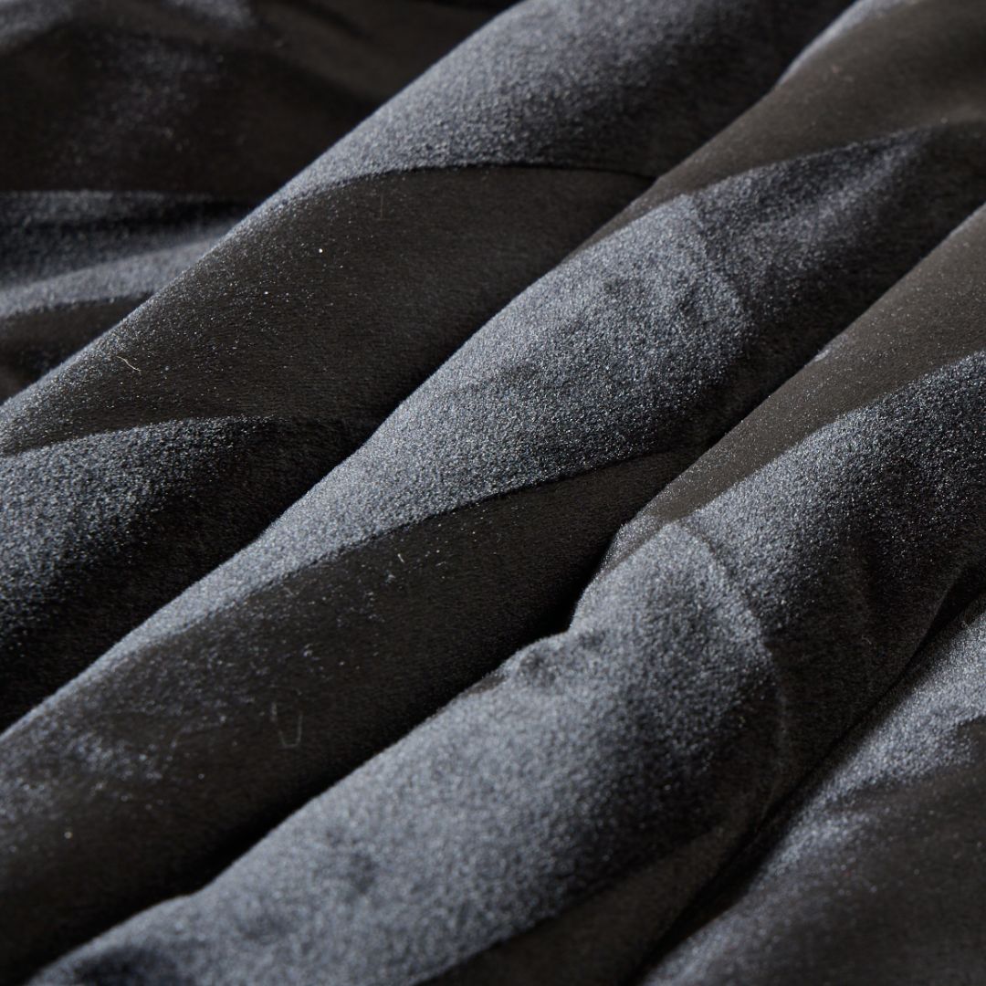 The Morgan and Reid Black Velvet Stripe Snuggle Fleece European Pillowcase Pair features square pillowcases in black with subtle alternating matte and velvet stripes, soft plush fleece fabric, and gently rounded edges.