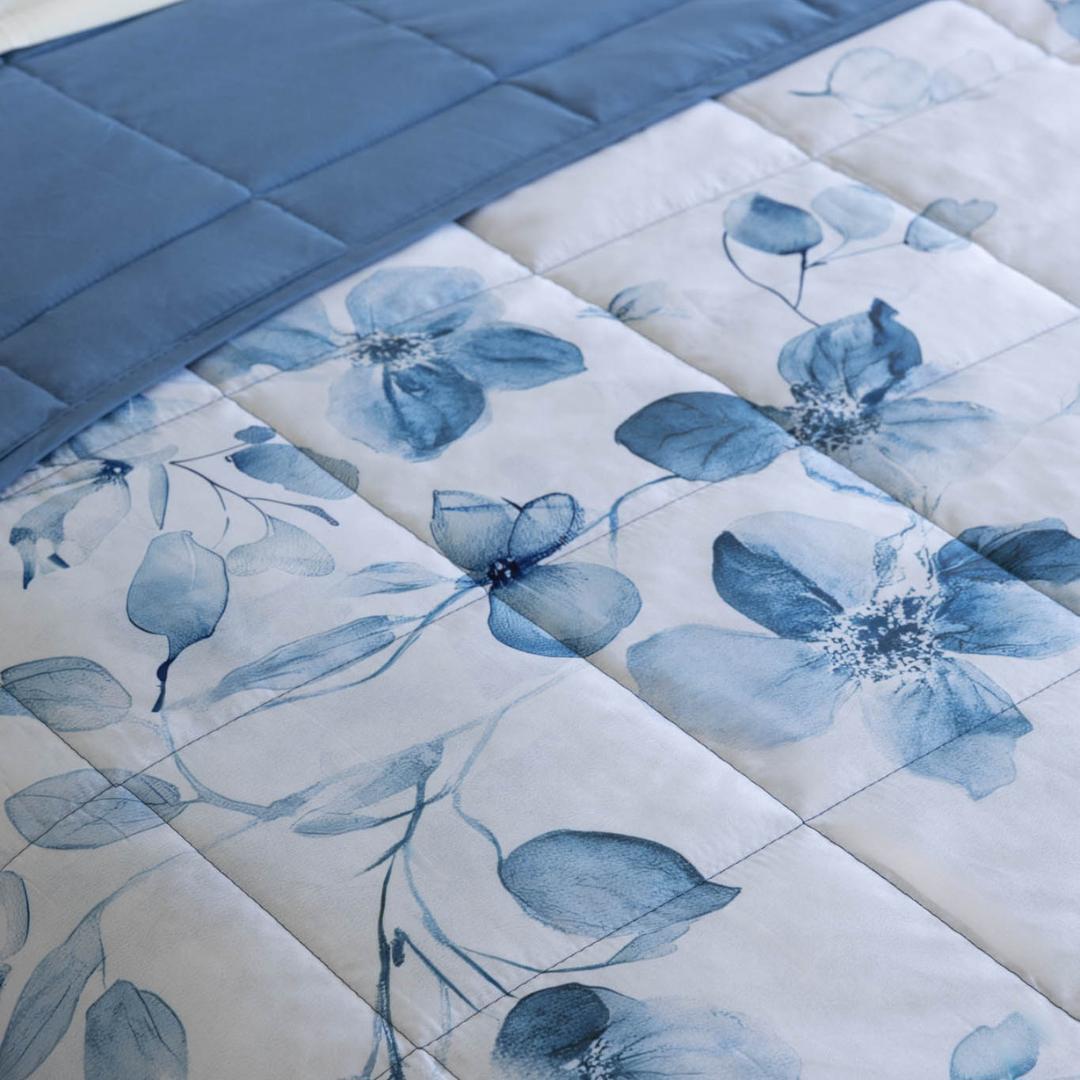 Morgan and Reid Blue Eucalyptus Cloudy Coverlet Set styled on a bed in a bright bedroom