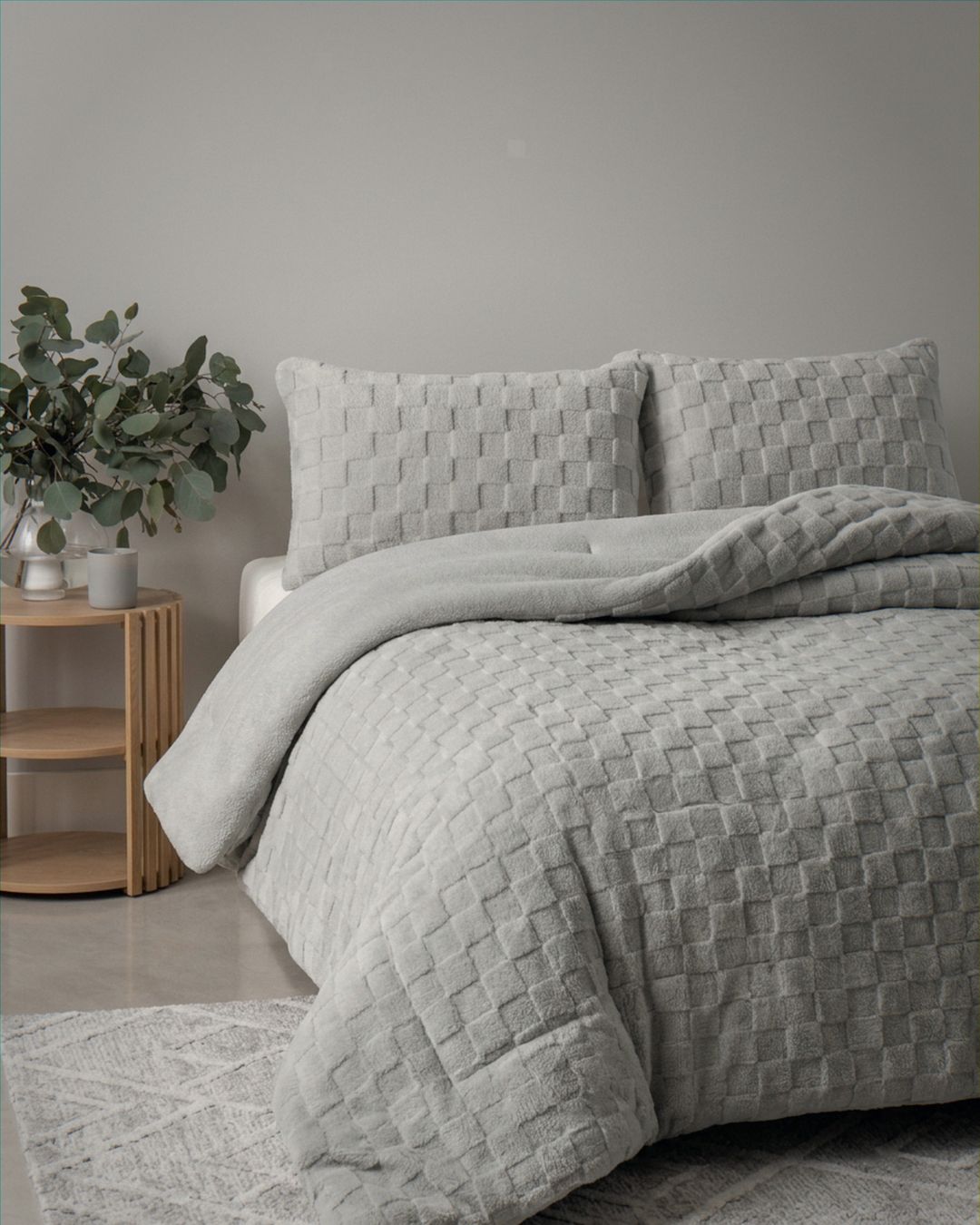 Detail shot of the Morgan and Reid Checkered Silver Snuggle Fleece Pillowcase Pair on pillows