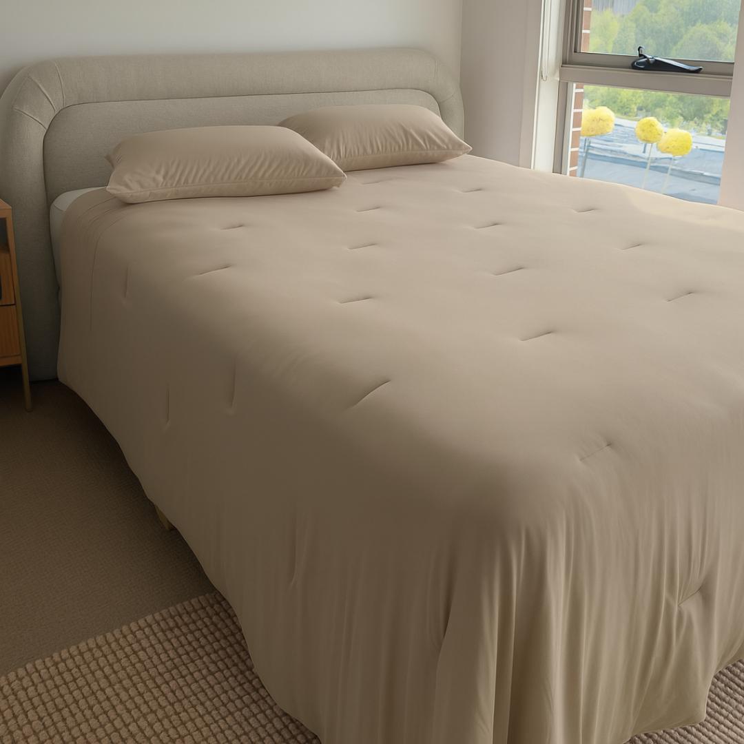 Lightweight doeskin cooling comforter with matching pillowcases.