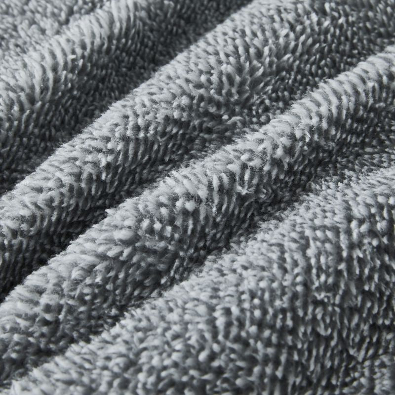 The Morgan and Reid Grey Spec Snuggle Fleece Pillowcase Pair features a modern speckled grey design and ultra-soft fleece, with slightly rounded corners, displayed on a plain white background.