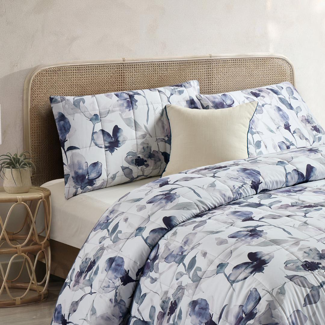 Morgan and Reid Midnight Orchid Cloudy Coverlet Set - Close-up of watercolour floral quilted fabric in grey and indigo.