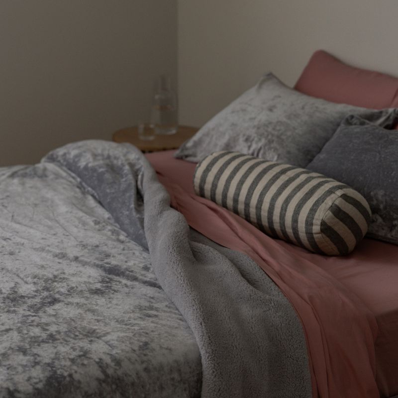 Morgan and Reid Silver Velvet Crushed Snuggle Fleece Pillowcase Pair on bed with coordinating bedding
