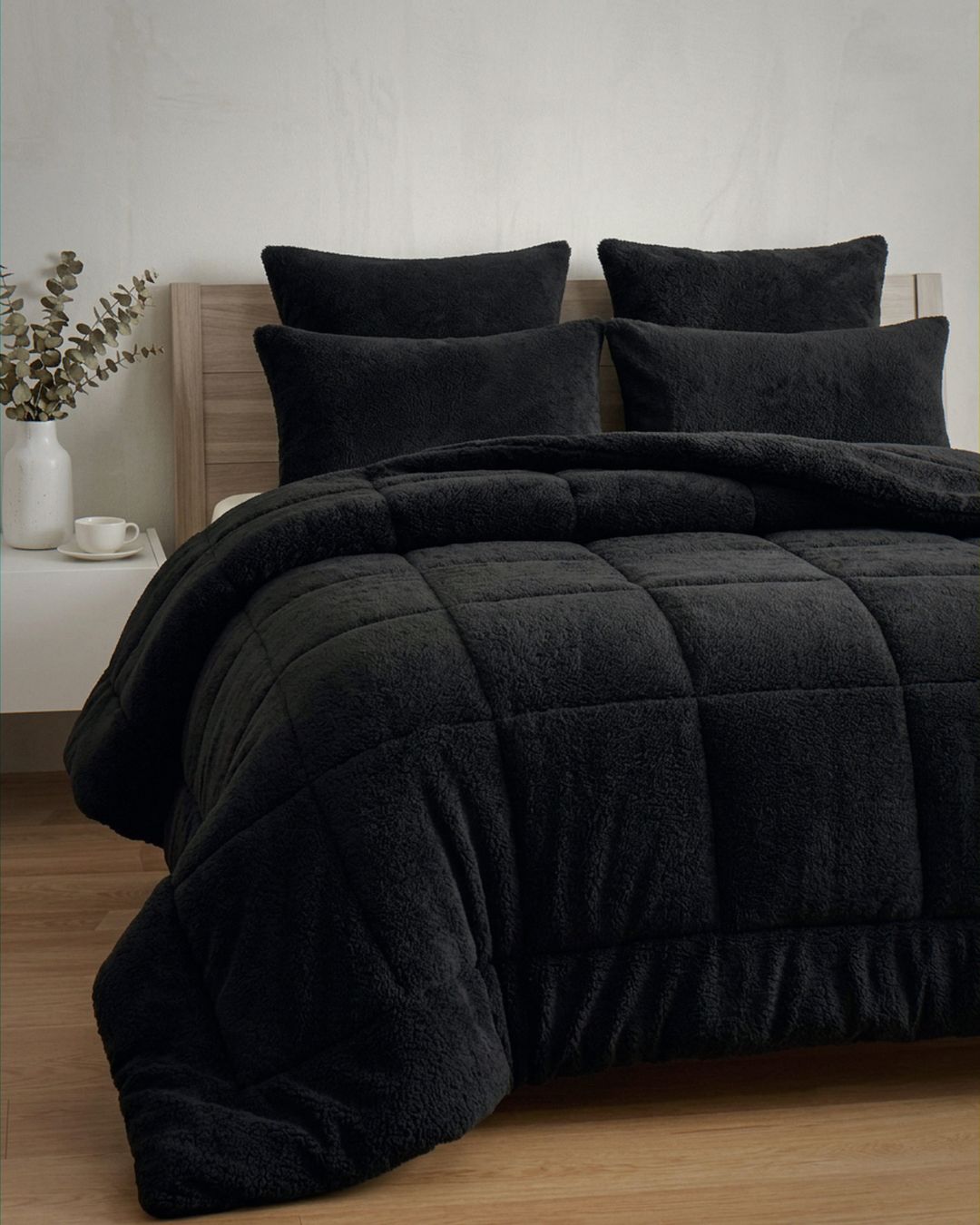 Detail shot of the Morgan and Reid Black Snuggle Fleece Pillowcase Pair on pillows