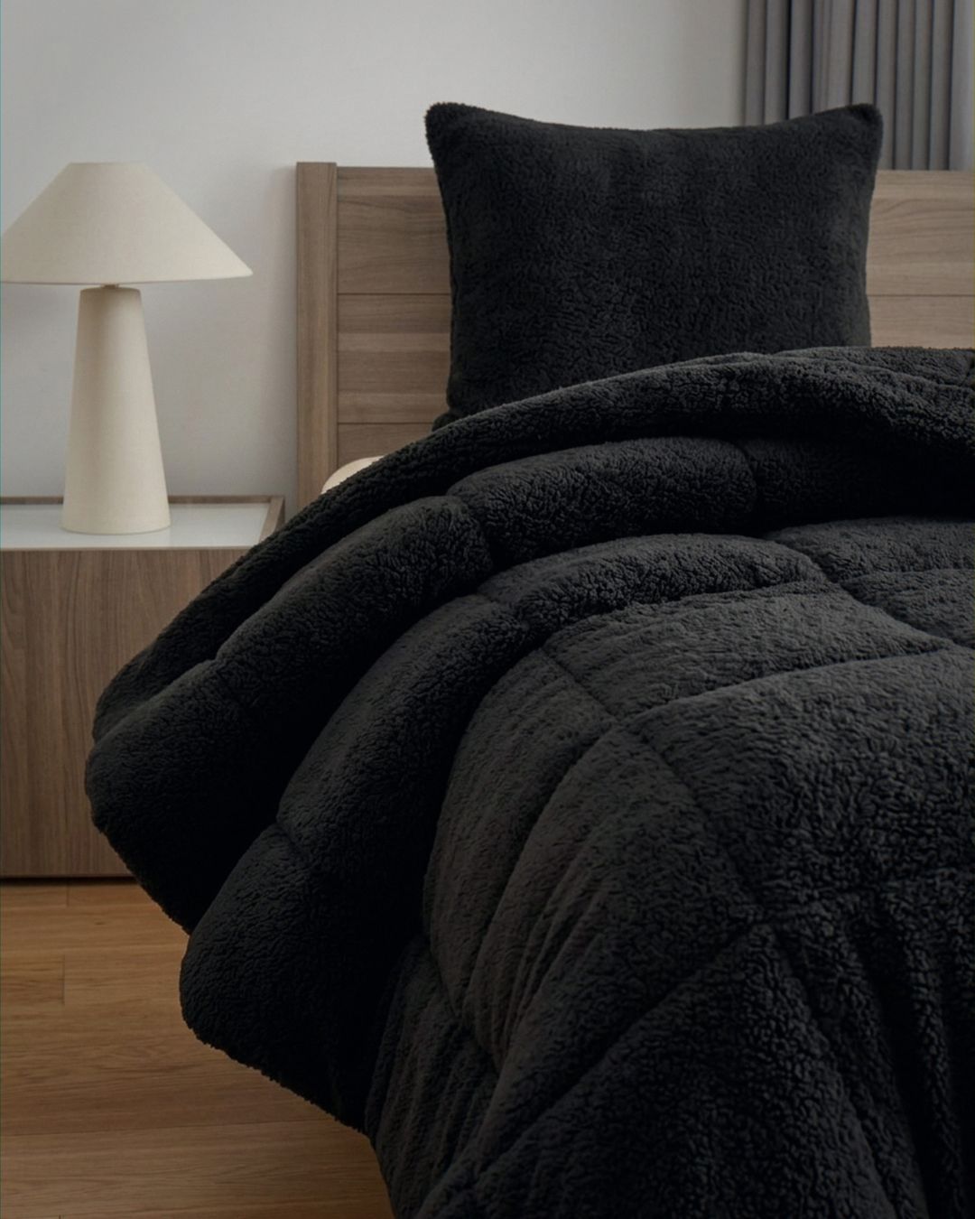 Close-up of the Morgan and Reid Black Snuggle Fleece European Pillowcase Pair showing fabric texture