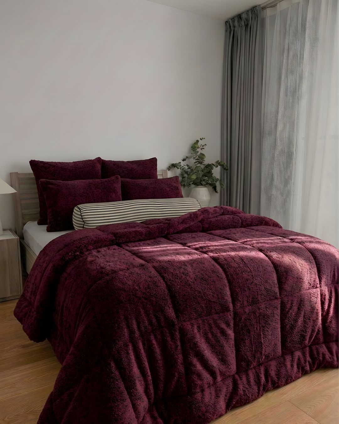Morgan and Reid Burgundy Black Snuggle Fleece Pillowcase Pair on bed with coordinating bedding