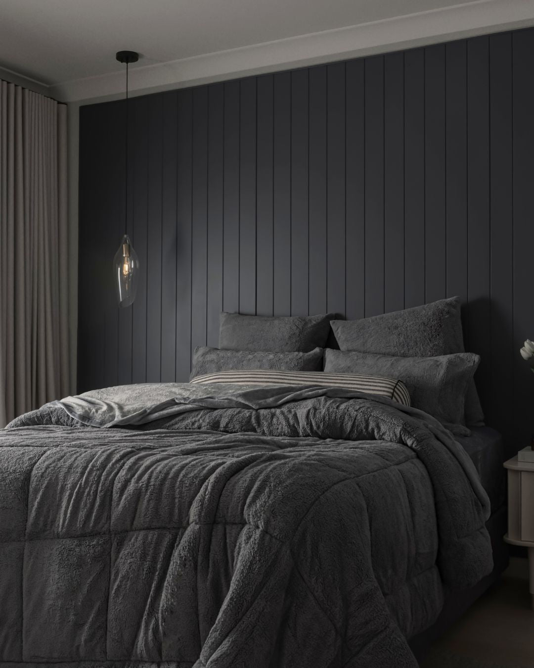 Morgan and Reid Steel Charcoal Snuggle Fleece Comforter Set styled on a neatly made bed in a bright bedroom