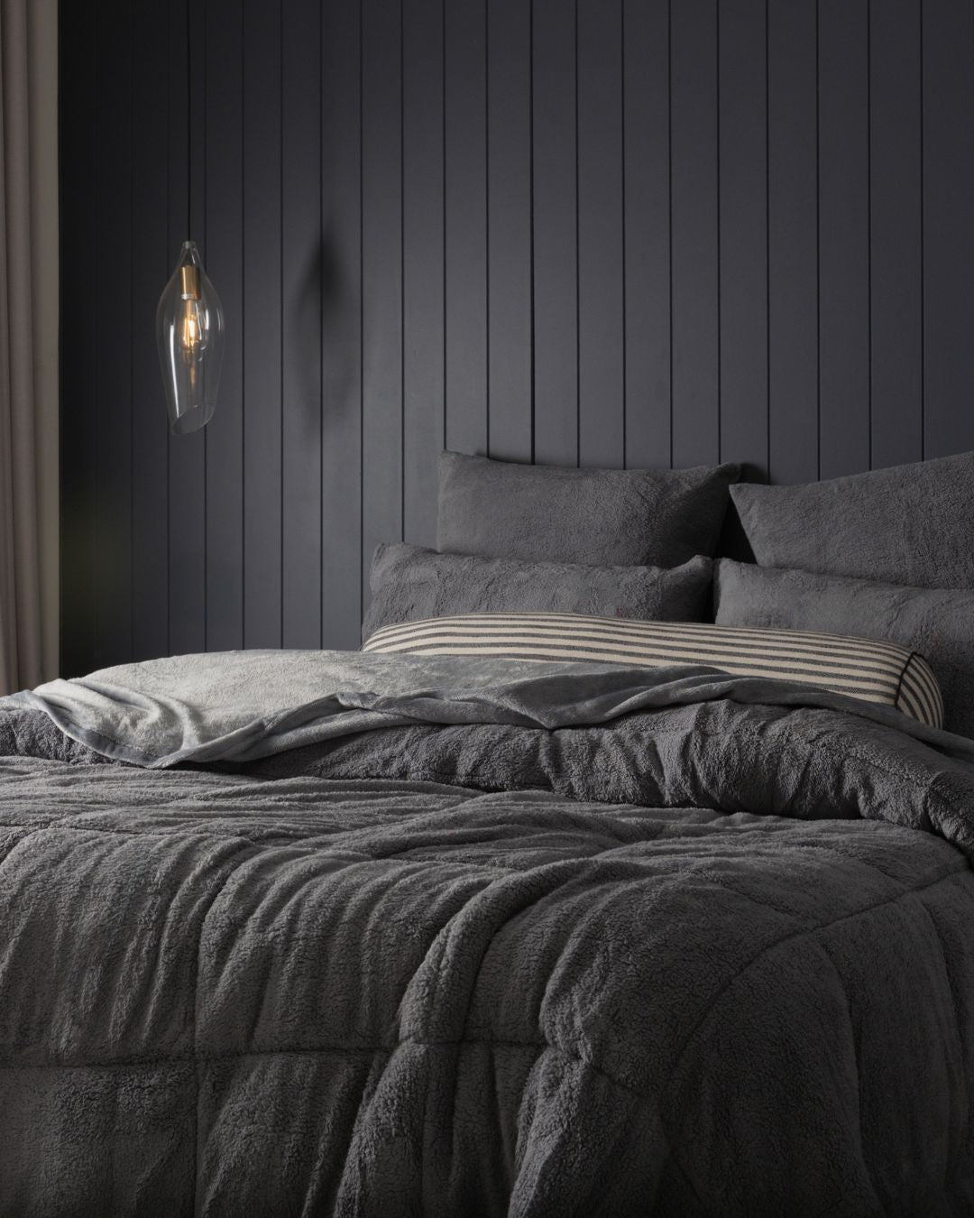 Morgan and Reid Charcoal Snuggle Fleece Pillowcase Pair on bed with coordinating bedding