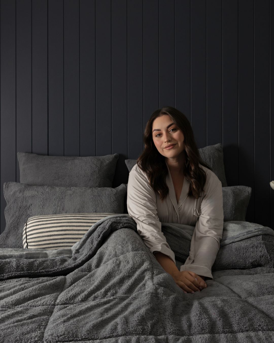 Morgan and Reid Steel Charcoal Snuggle Fleece Comforter Set on a bed with matching pillowcases