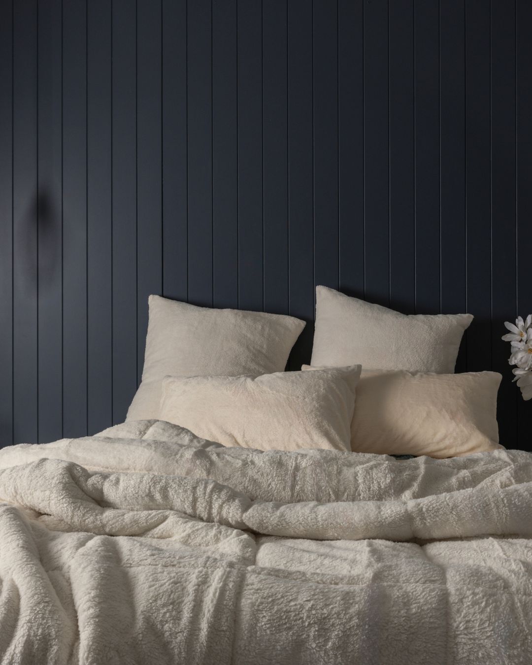 Morgan and Reid Ivory Snuggle Fleece Comforter Set on a bed with matching pillowcases