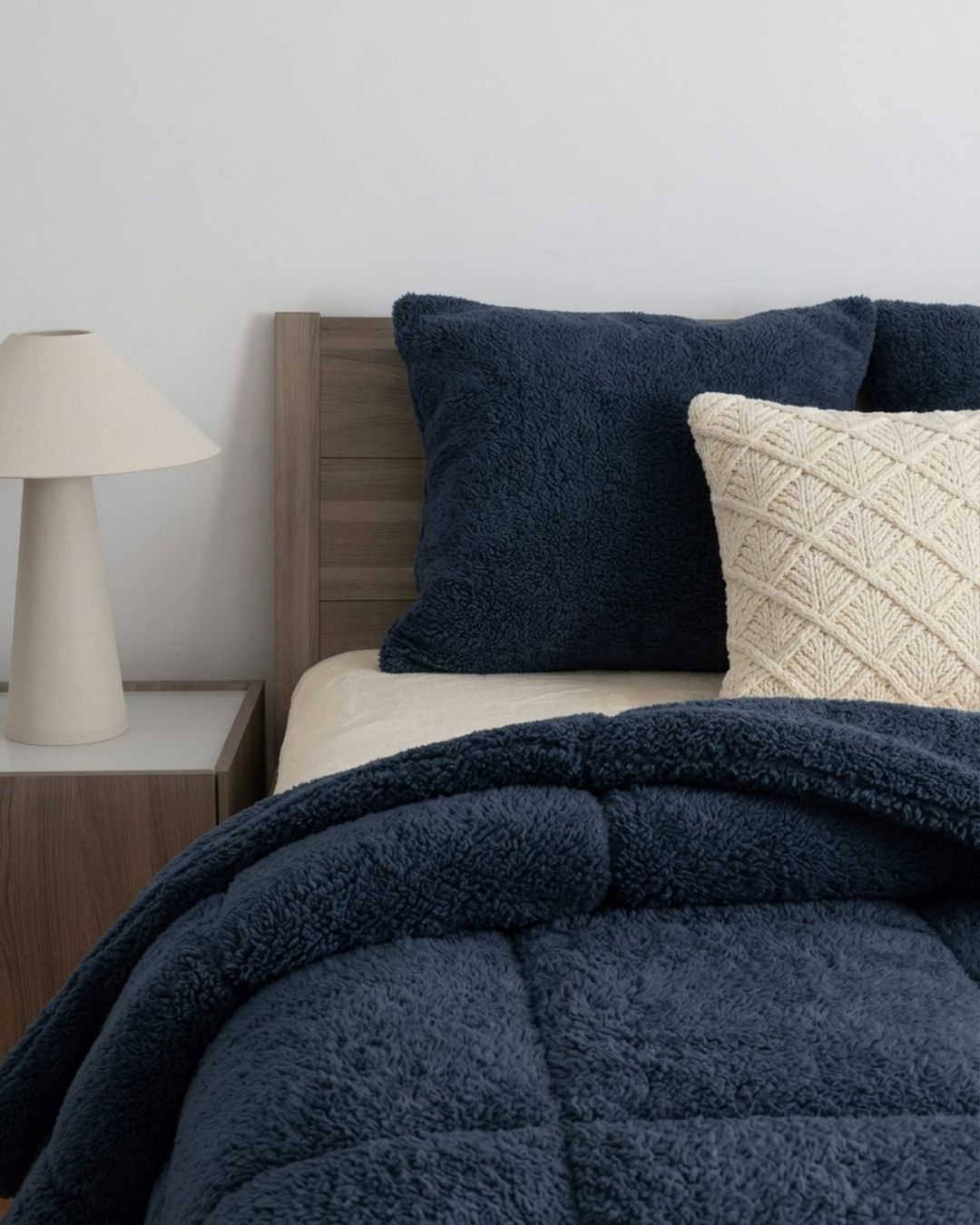 Morgan and Reid Midnight Blue Snuggle Fleece Pillowcase Pair on bed with coordinating bedding