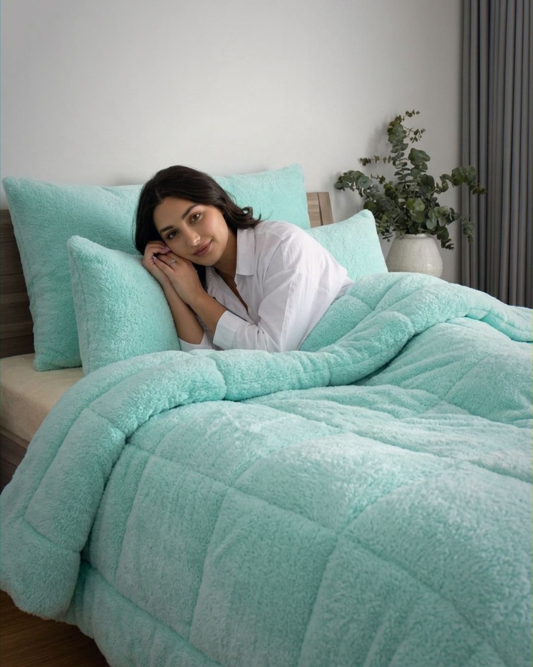 Morgan and Reid Mint Snuggle Fleece Pillowcase Pair on bed with coordinating bedding
