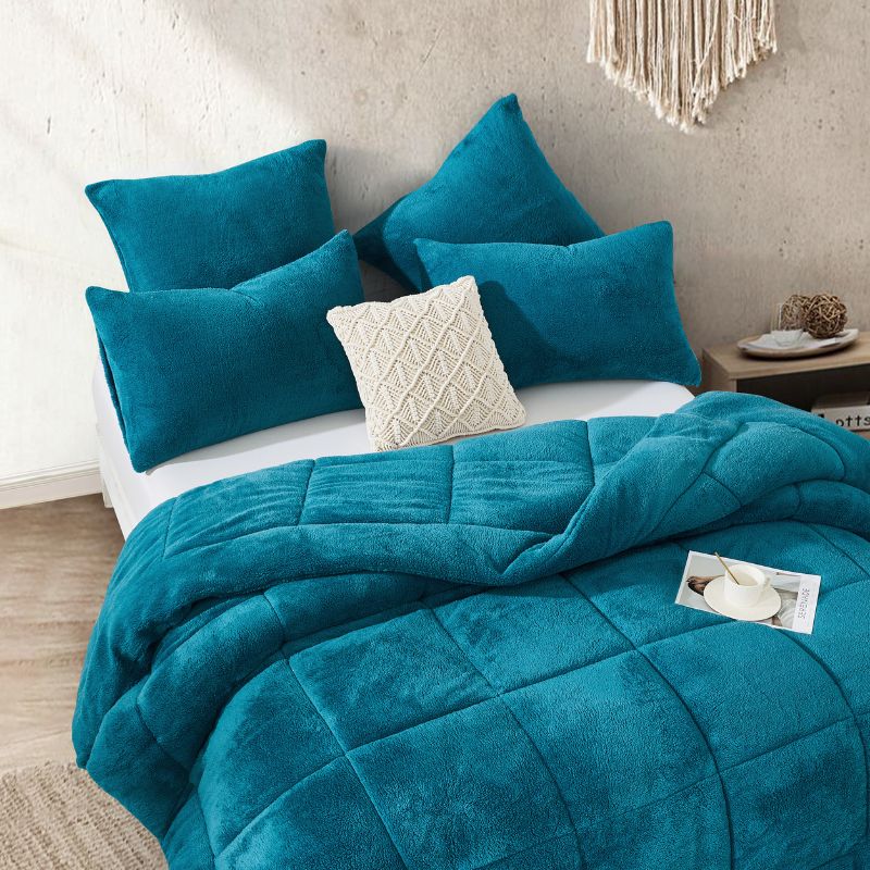 The Morgan and Reid Riverside Snuggle Fleece Pillowcase Pair features a soft, textured teal fleece finish and is displayed against a plain white background.