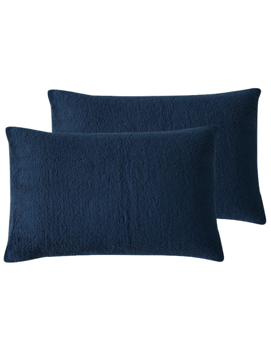 Morgan and Reid Midnight Blue Snuggle Fleece Pillowcase Pair on a styled bed with matching comforter
