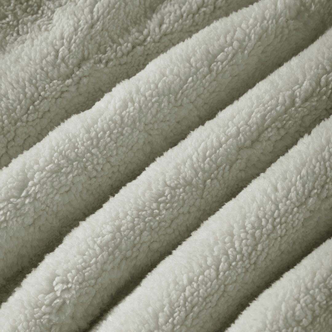 Detail shot of the Morgan and Reid Checkered Soft Sage Snuggle Fleece European Pillowcase Pair on a pillow