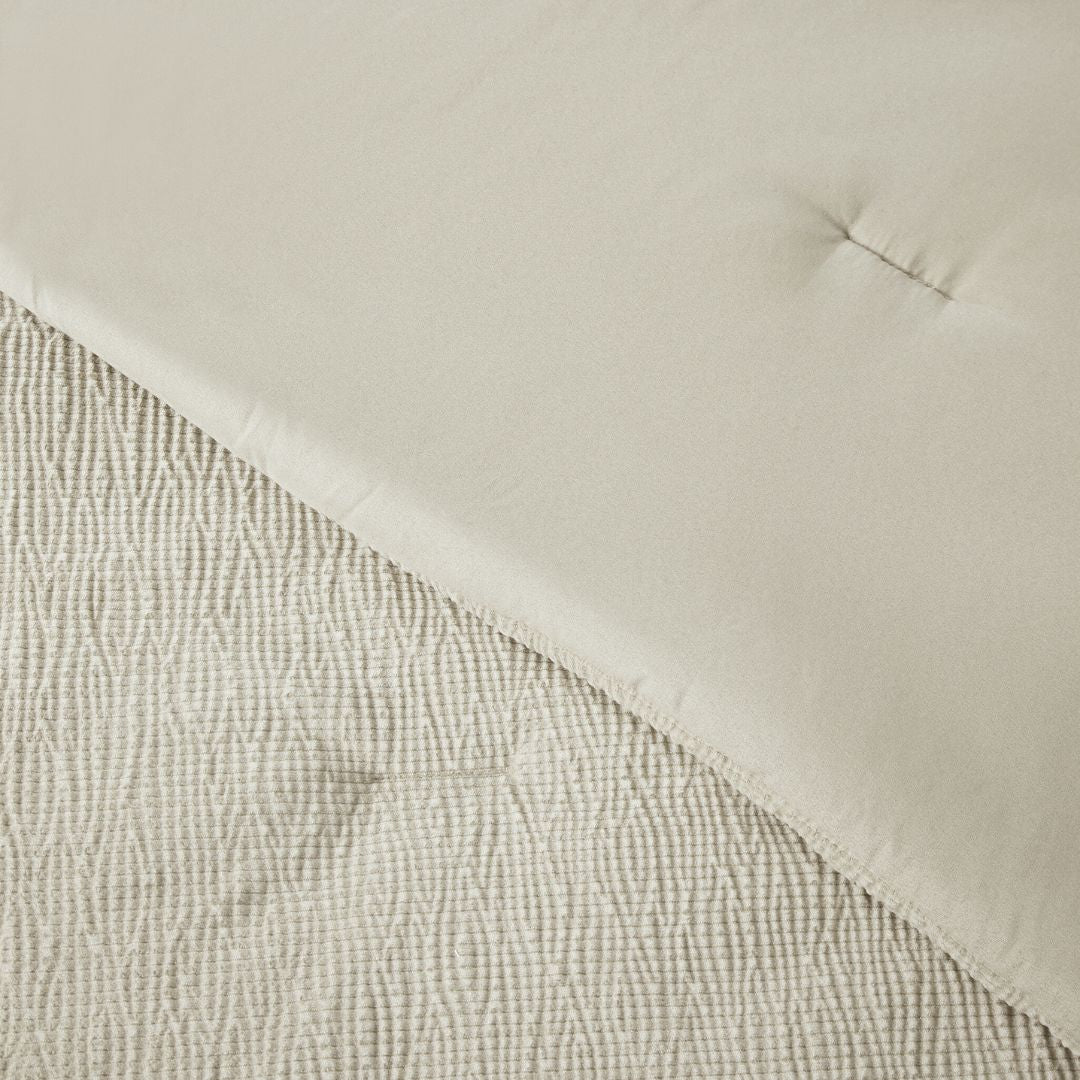 Close-up of a textured fabric with a neutral color palette
