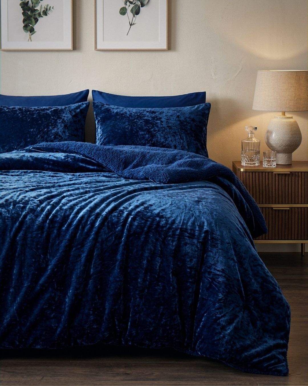 Detail shot of the Morgan and Reid Navy Velvet Crushed Snuggle Fleece Pillowcase Pair on pillows