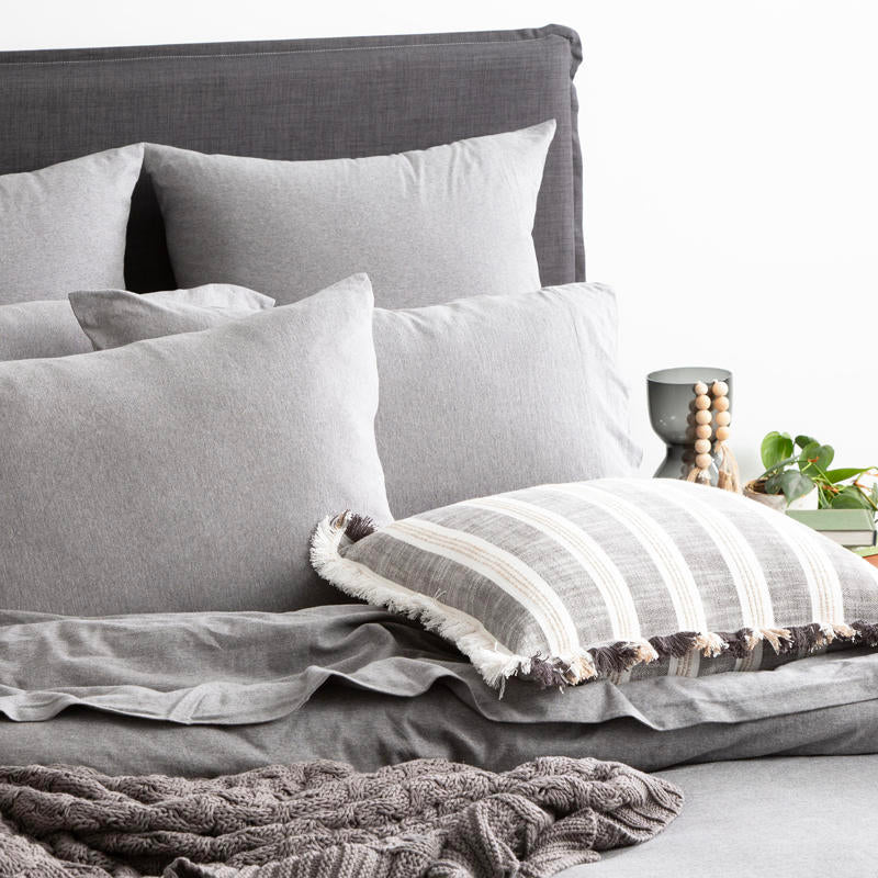 Styled bed featuring Renee Taylor Charcoal European Pillowcase with matching jersey bedding.