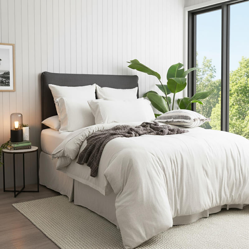 Styled bed featuring Renee Taylor Ecru European Pillowcase with matching organic cotton jersey bedding.