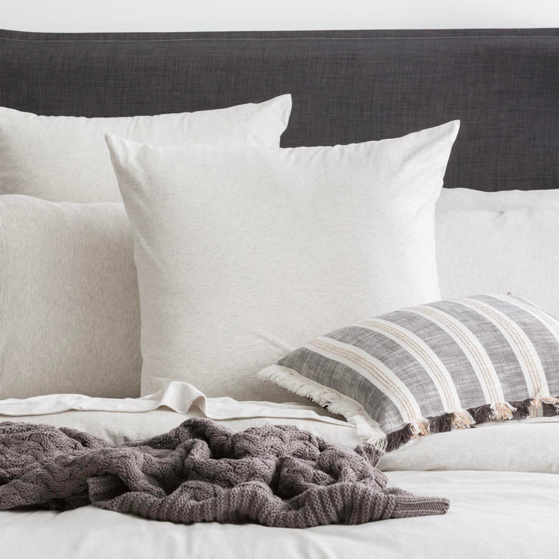 Styled bed featuring Renee Taylor Ecru European Pillowcase with matching organic cotton jersey bedding.