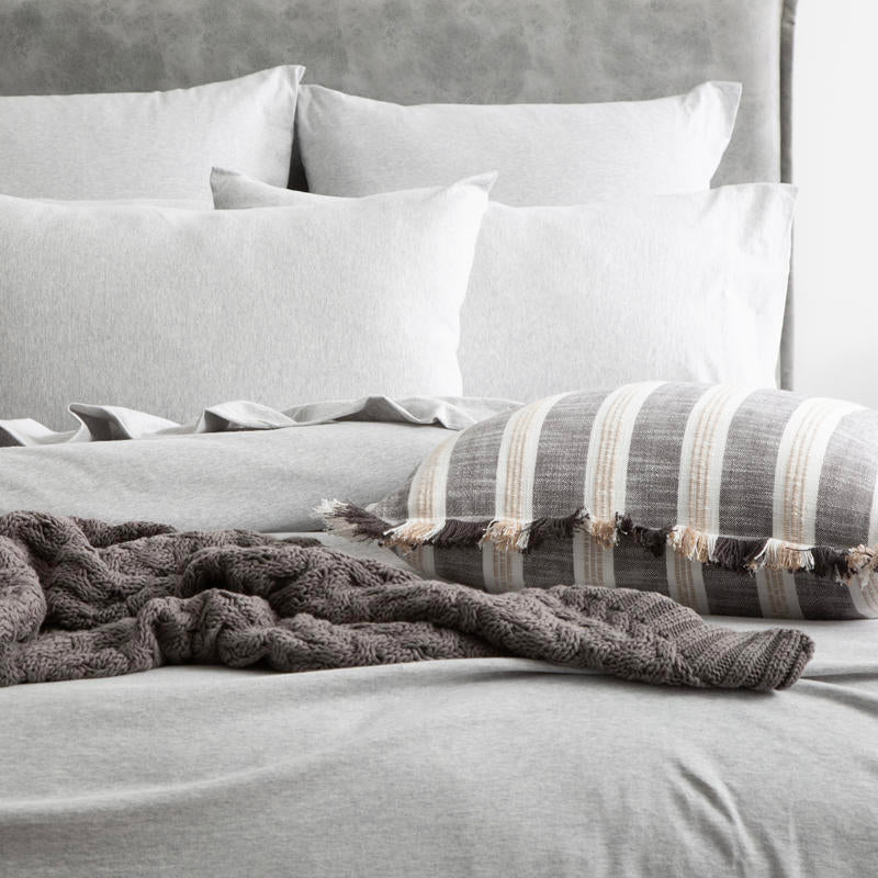Styled bed featuring Renee Taylor Grey Marle European Pillowcase with matching jersey bedding.
