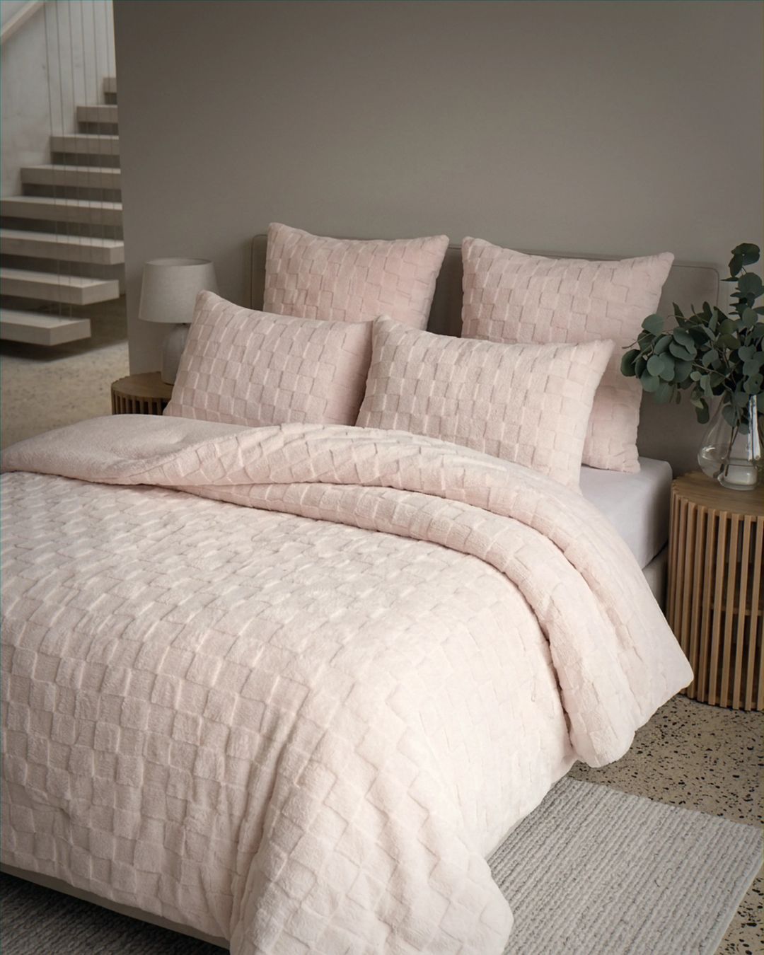 Soft Pink Checkered Snuggle Fleece Comforter Set styled on bed with matching pillows in cozy bedroom setting