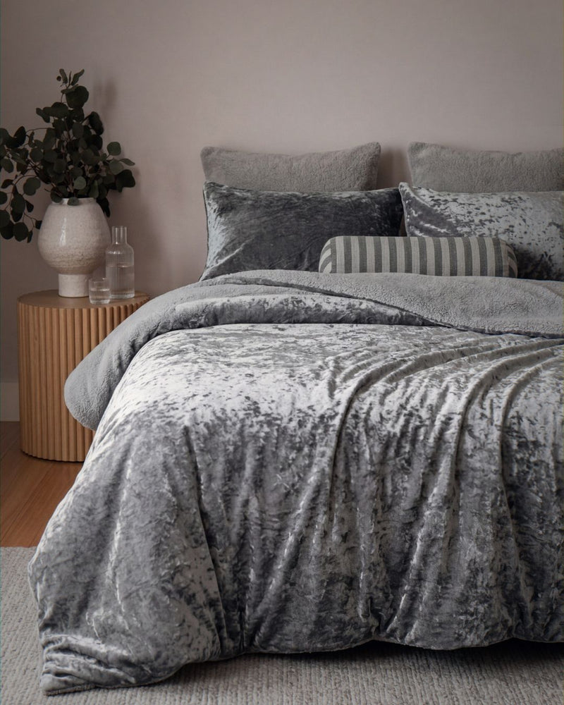 velvet crushed blush comforter on bed