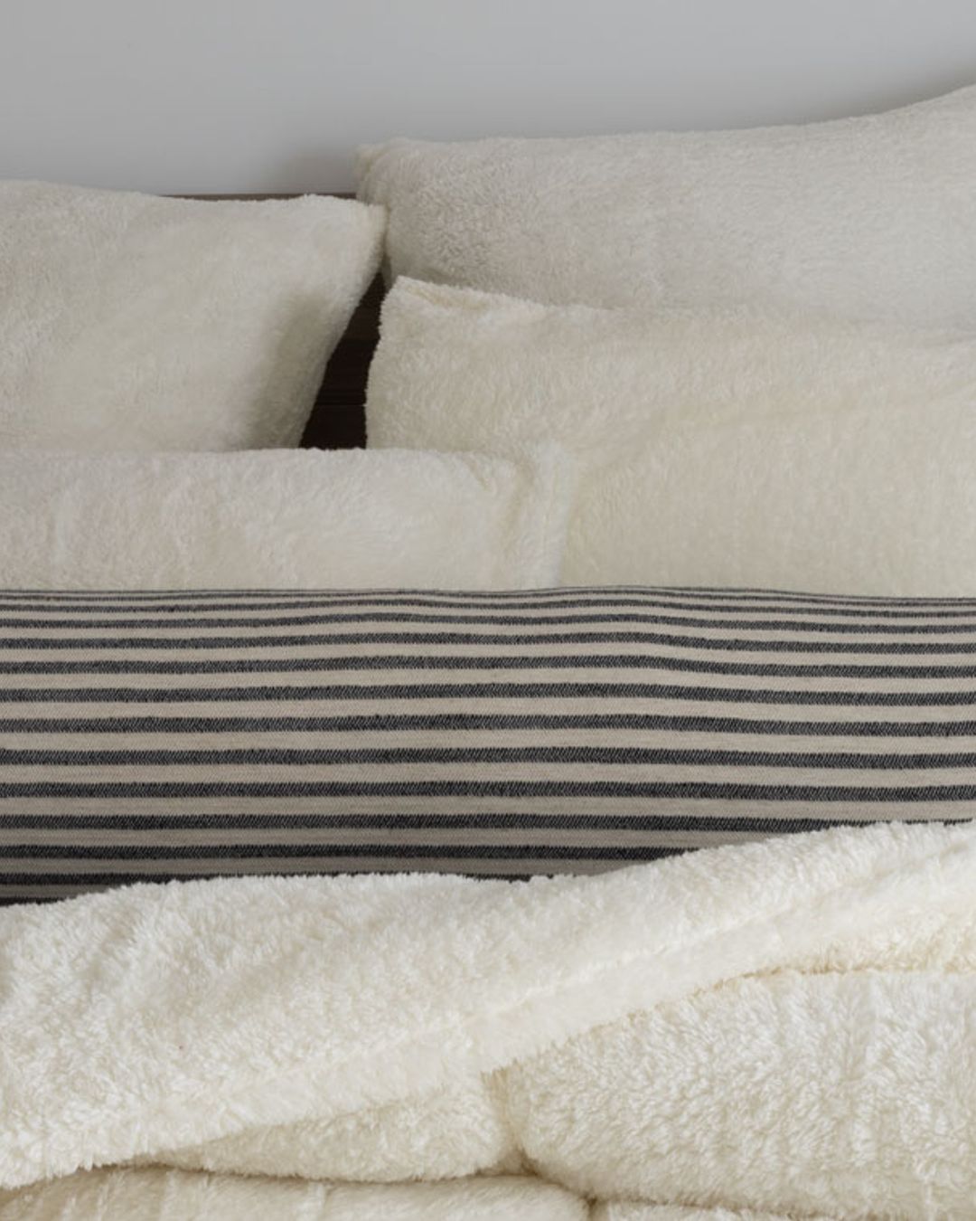 Close-up of the Morgan and Reid Bright White Snuggle Fleece European Pillowcase Pair showing fabric texture
