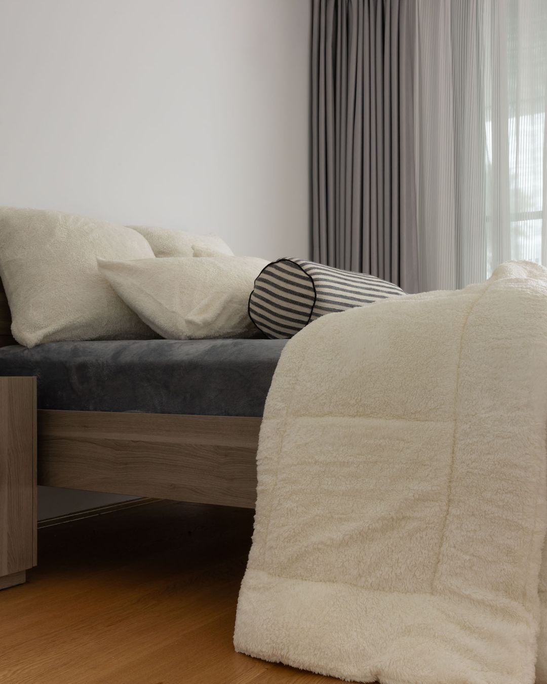 Morgan and Reid Bright White Snuggle Fleece European Pillowcase Pair on bed with coordinating bedding