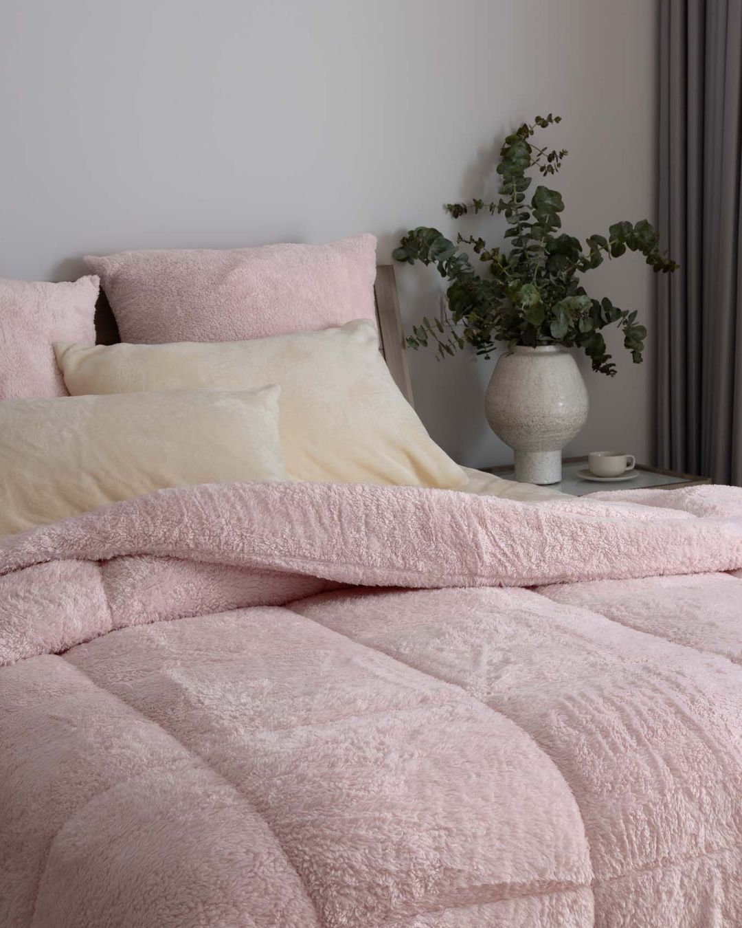 Close-up of the Morgan and Reid Chalk Pink Snuggle Fleece European Pillowcase Pair showing fabric texture