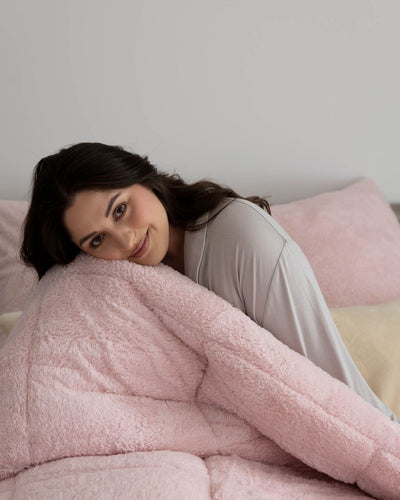 Morgan and Reid Chalk Pink Snuggle Fleece Comforter Set folded to show depth and plush texture
