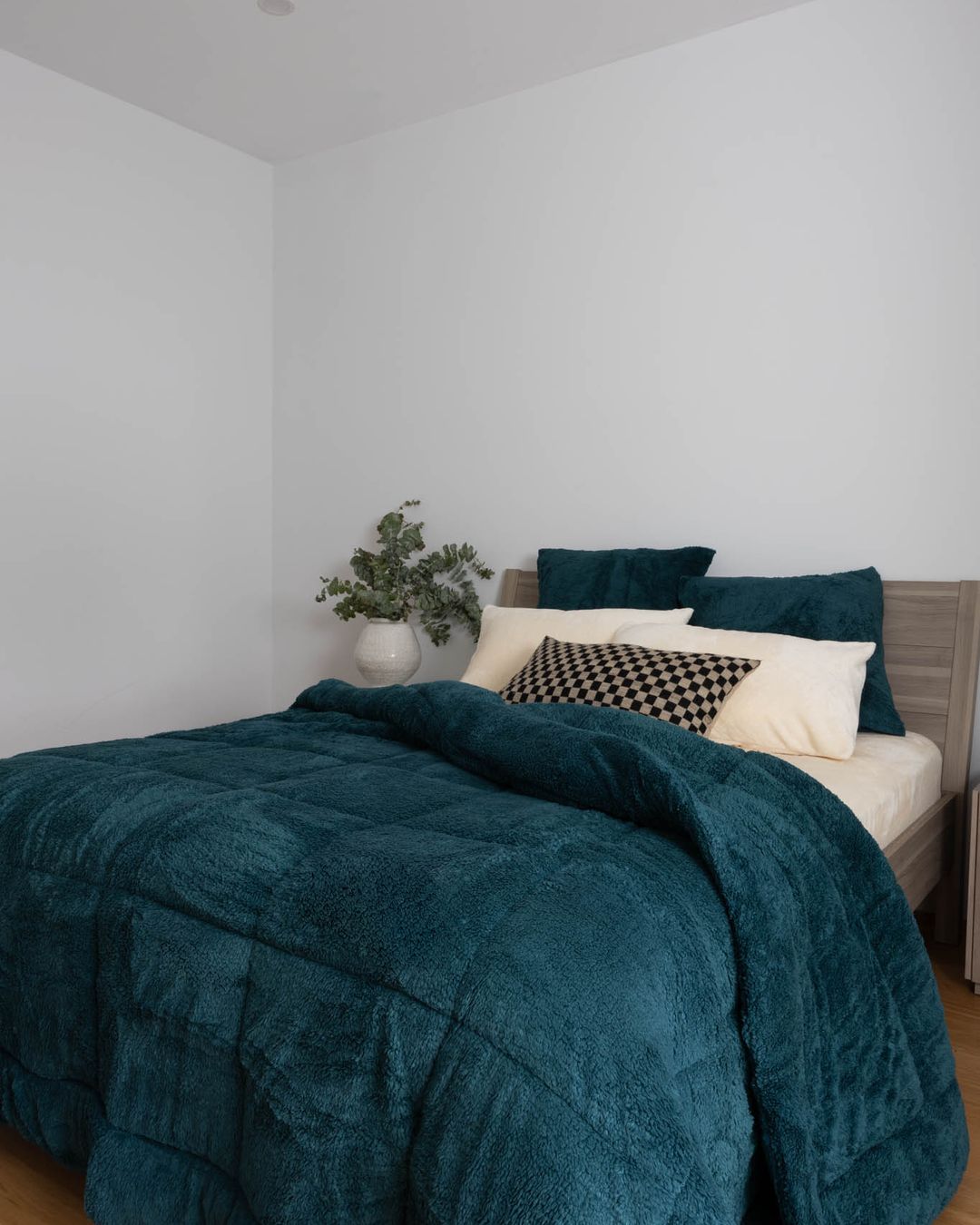Morgan and Reid Deep Teal Snuggle Fleece Pillowcase Pair on bed with coordinating bedding
