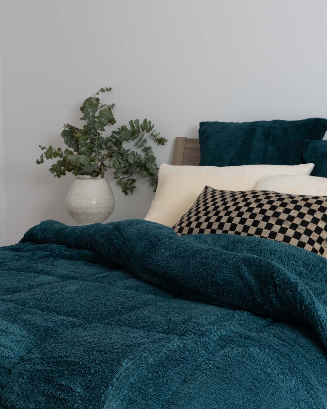 Detail shot of the Morgan and Reid Deep Teal Snuggle Fleece European Pillowcase Pair on a pillow