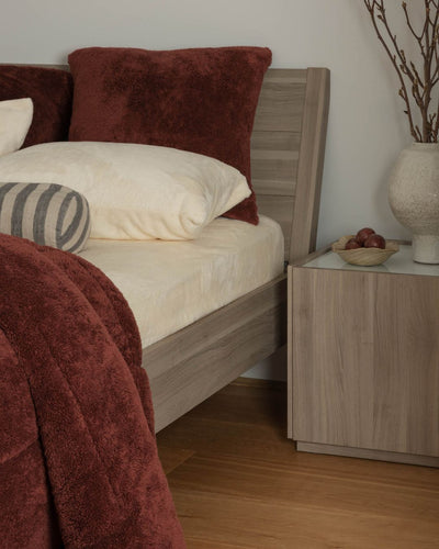 Morgan and Reid Hot Chocolate Snuggle Fleece European Pillowcase Pair on bed with coordinating bedding