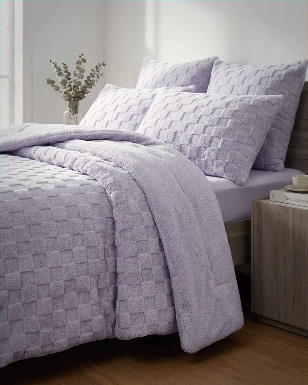 Lavender checkered snuggle fleece comforter set styled on bed with matching pillow shams in cozy bedroom setting
