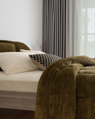 Morgan and Reid Military Olive Snuggle Fleece European Pillowcase Pair on bed with coordinating bedding