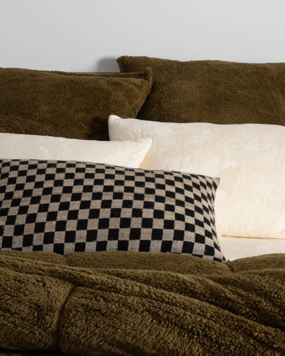 Close-up of the Morgan and Reid Military Olive Snuggle Fleece European Pillowcase Pair showing fabric texture