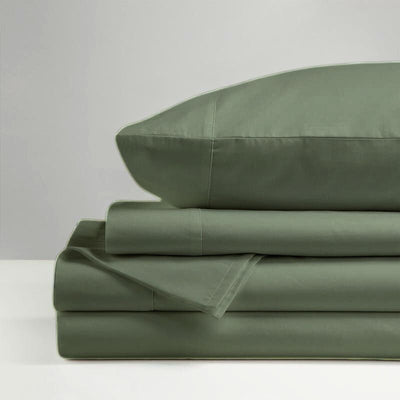 The Morgan and Reid Hotel 1500 Thread Count Cotton Rich Sheet Set, with pillowcases and one pillow on top, is neatly stacked and displayed against a plain light gray background.