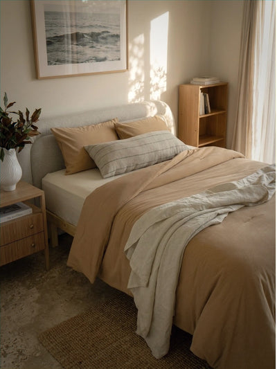 Cozy bedroom with a bed, side table, and bookshelf.