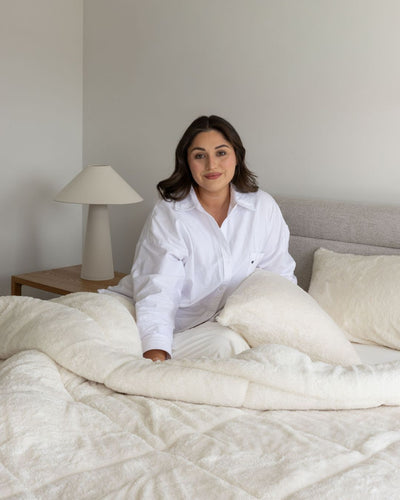 Morgan and Reid All Seasons Snuggle Fleece Ivory Comforter Set folded to show depth and plush texture