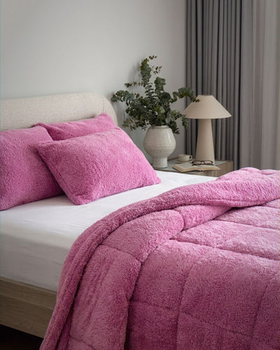 Overhead view of the Morgan and Reid All Seasons Snuggle Fleece Crocus Comforter Set on a made bed