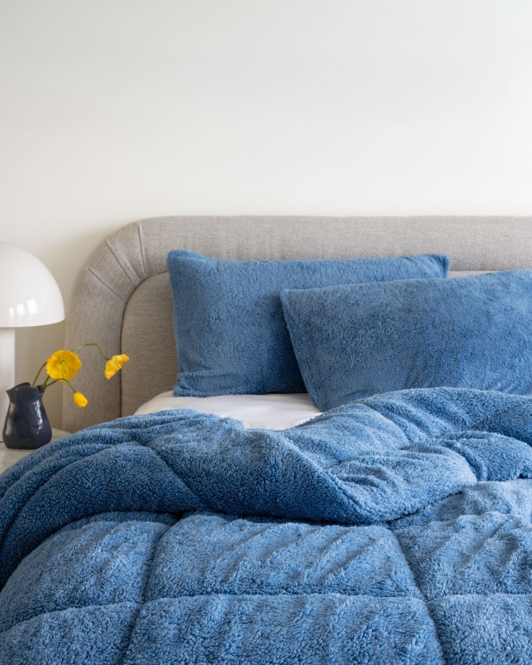 Morgan and Reid All Seasons Snuggle Fleece Smokey Blue Comforter Set in a cosy bedroom lifestyle setting