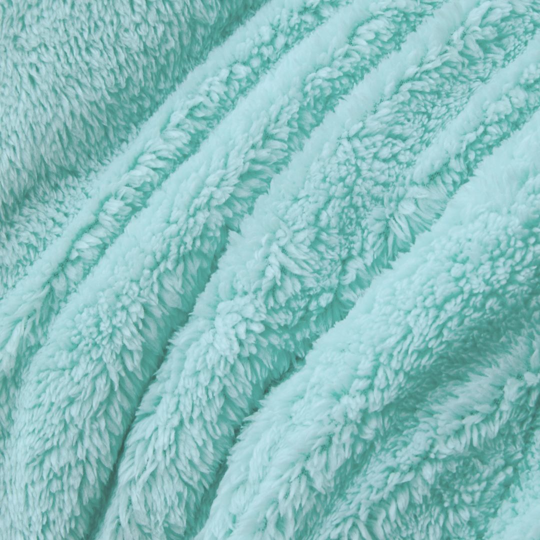 Close-up of a textured teal fabric